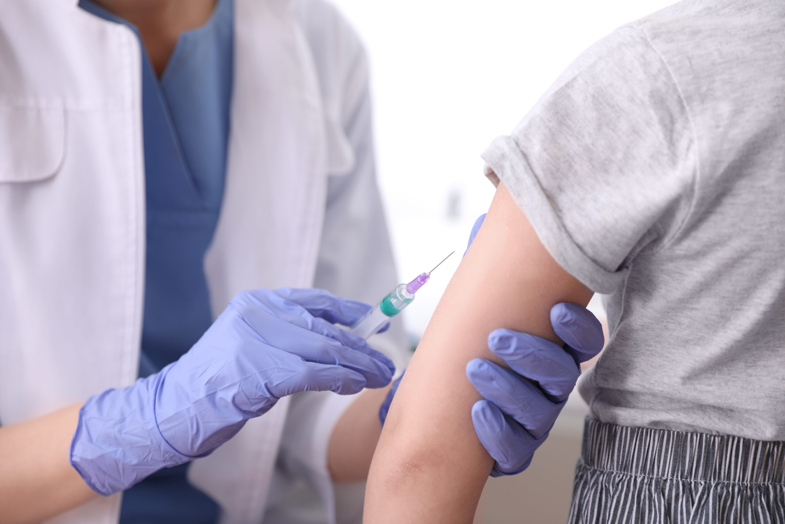 Little girl receiving chickenpox vaccination in clinic