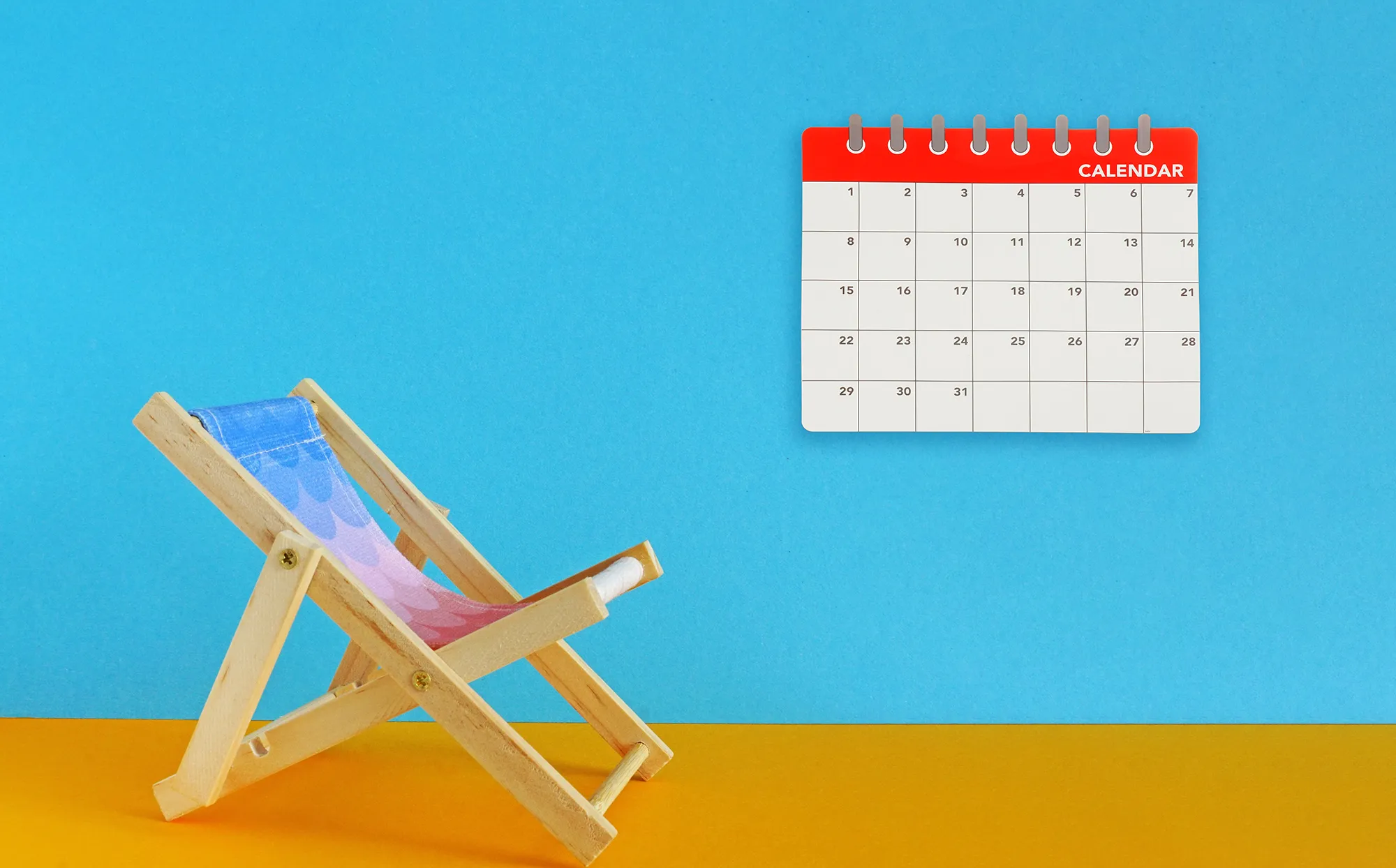 beach chair and calendar with blue and yellow background